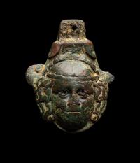 A Roman Bronze Terminal in the Form of a Medusa Head with Silver Inlaid Eyes