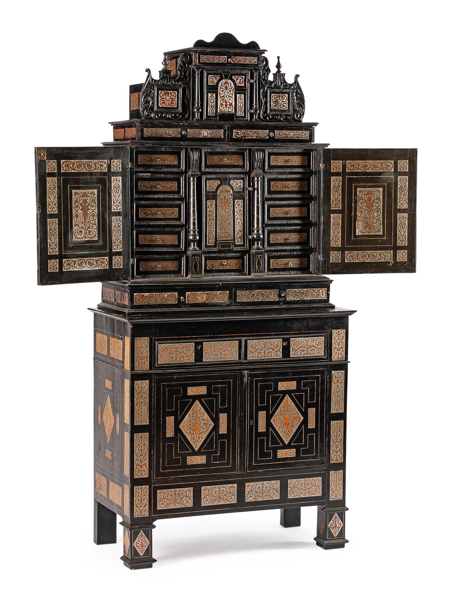 A Continental Pewter Inlaid and Ebonized Cabinet
