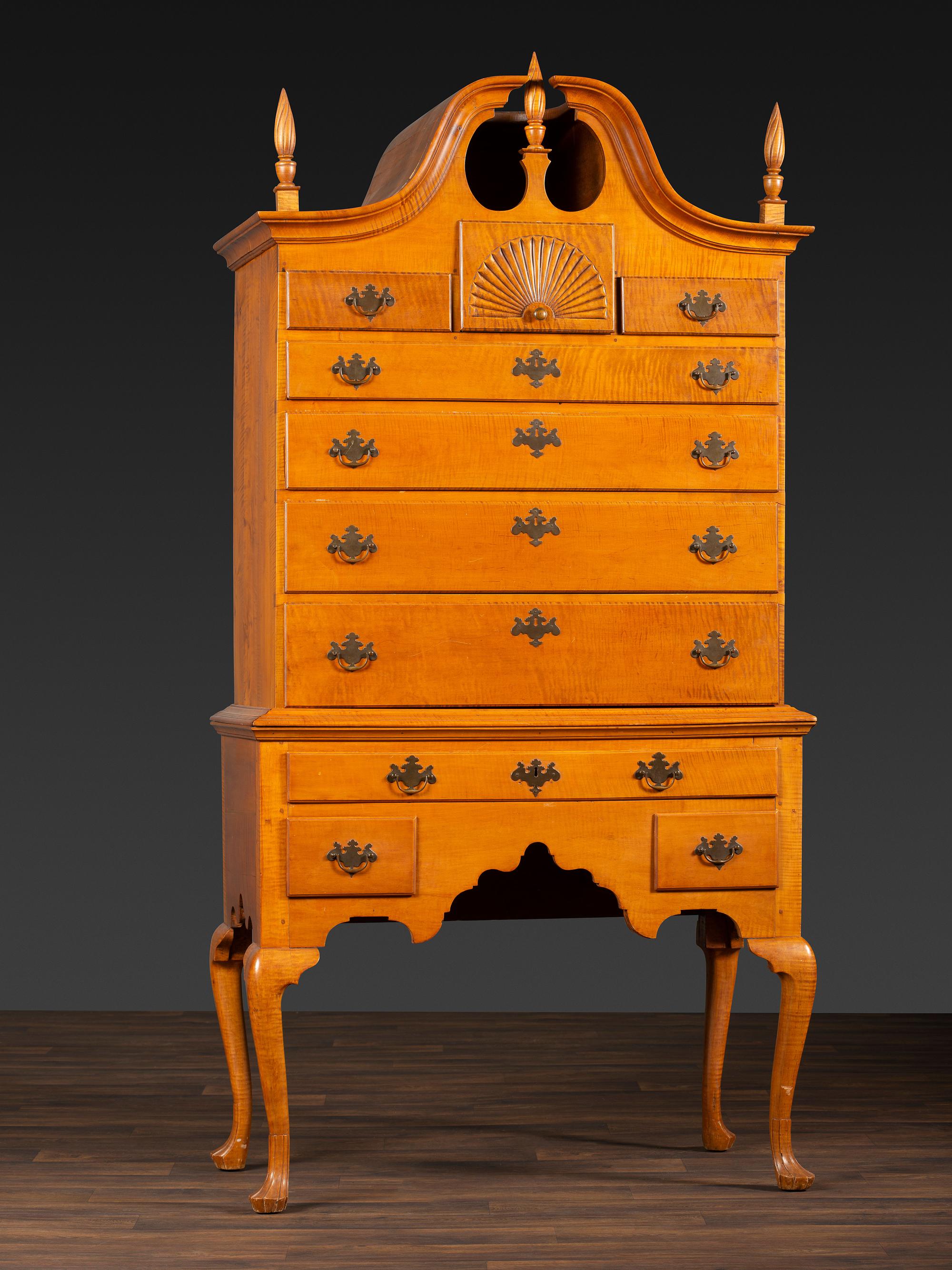 A Queen Anne Fan-Carved Tiger Maple Bonnet-Top Tablet-Foot High Chest