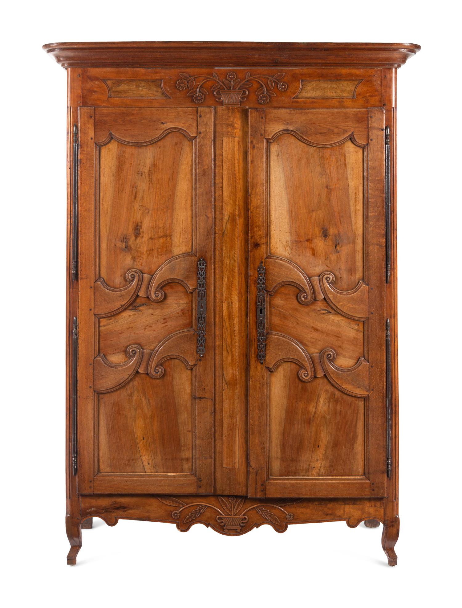A French Provincial Walnut and Fruitwood Armoire