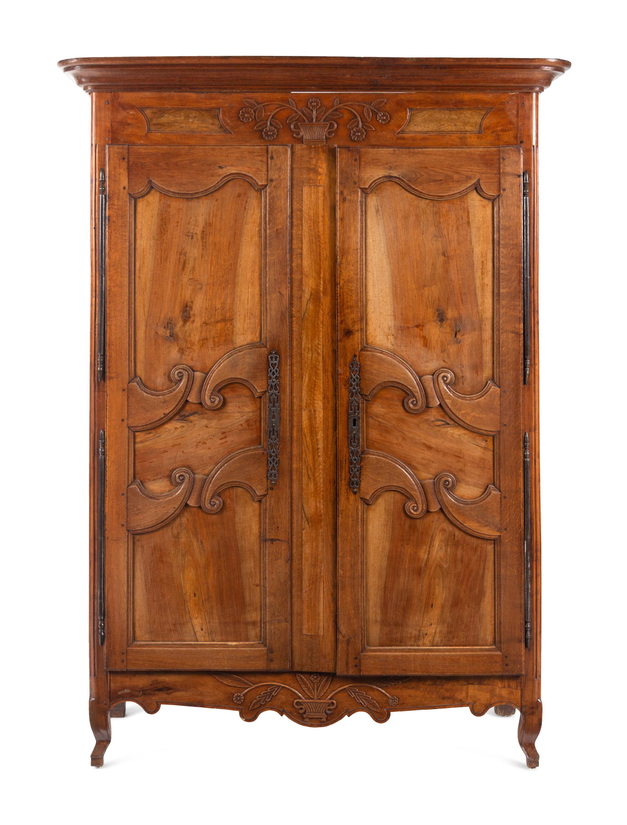 A French Provincial Walnut and Fruitwood Armoire