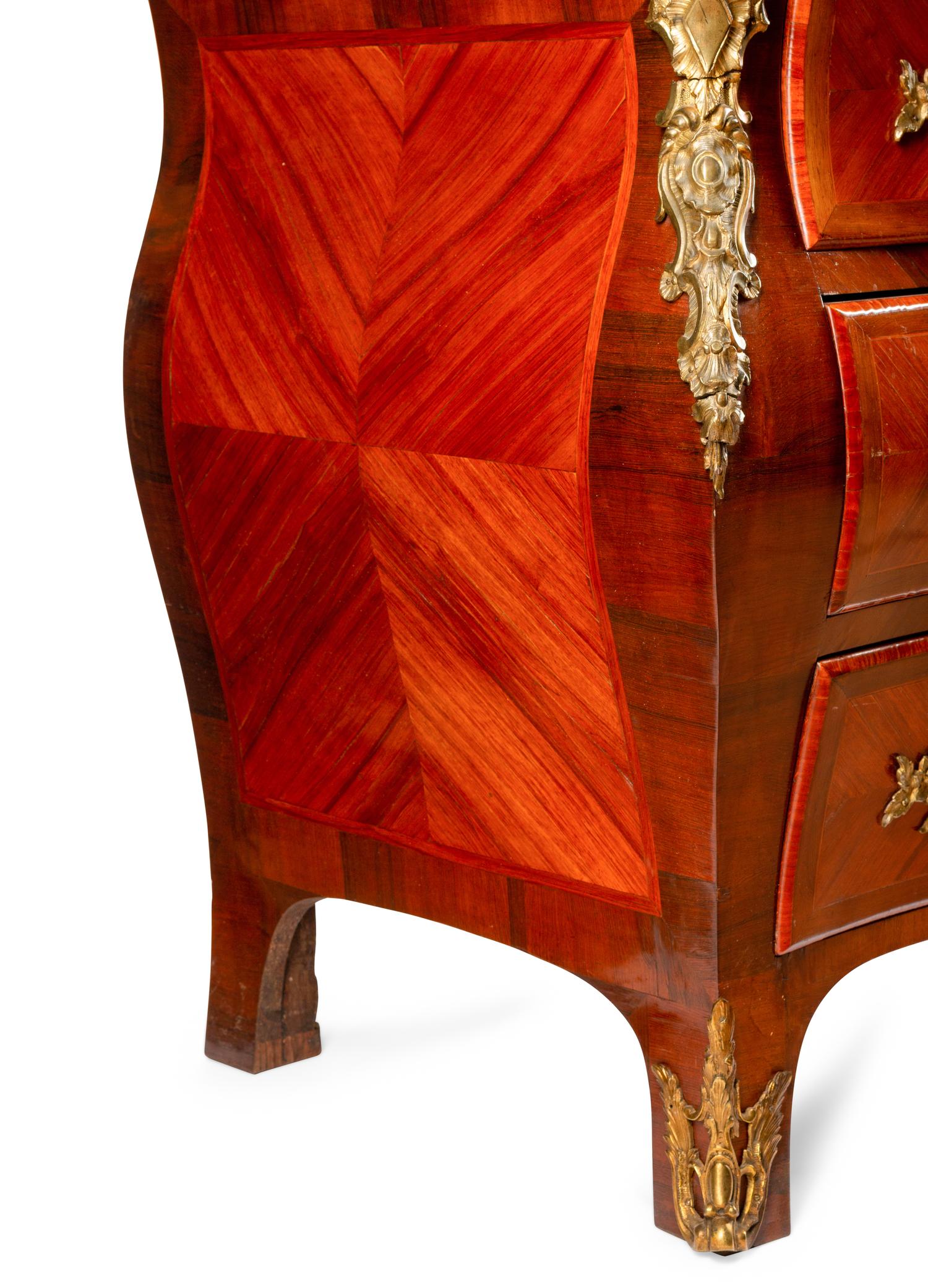 A Régence Style Gilt Bronze Mounted Kingwood Marble-Top Commode