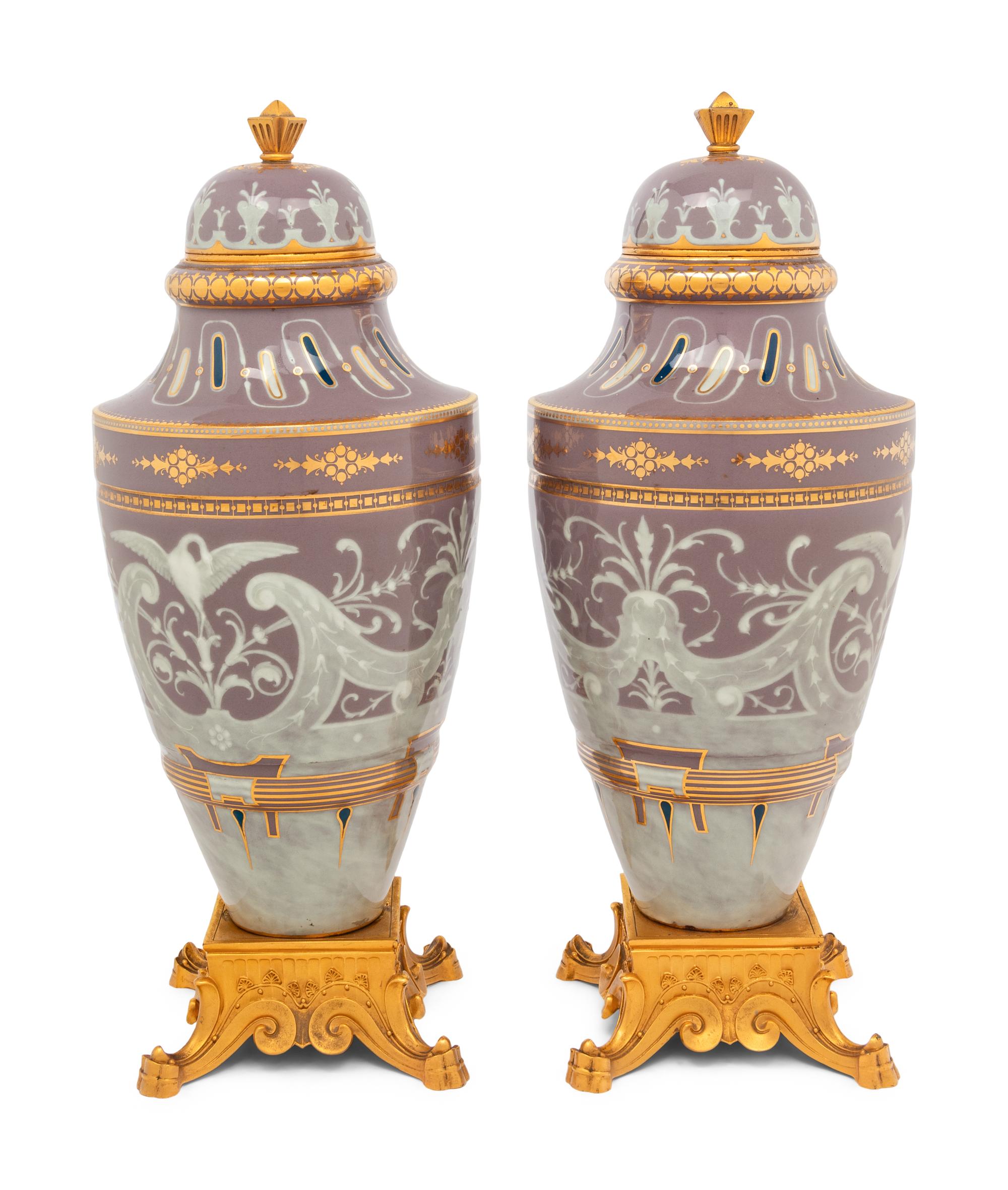A Pair of Continental Pâte-sur-Pâte Porcelain and Gilt-Bronze Mounted Covered Urns
