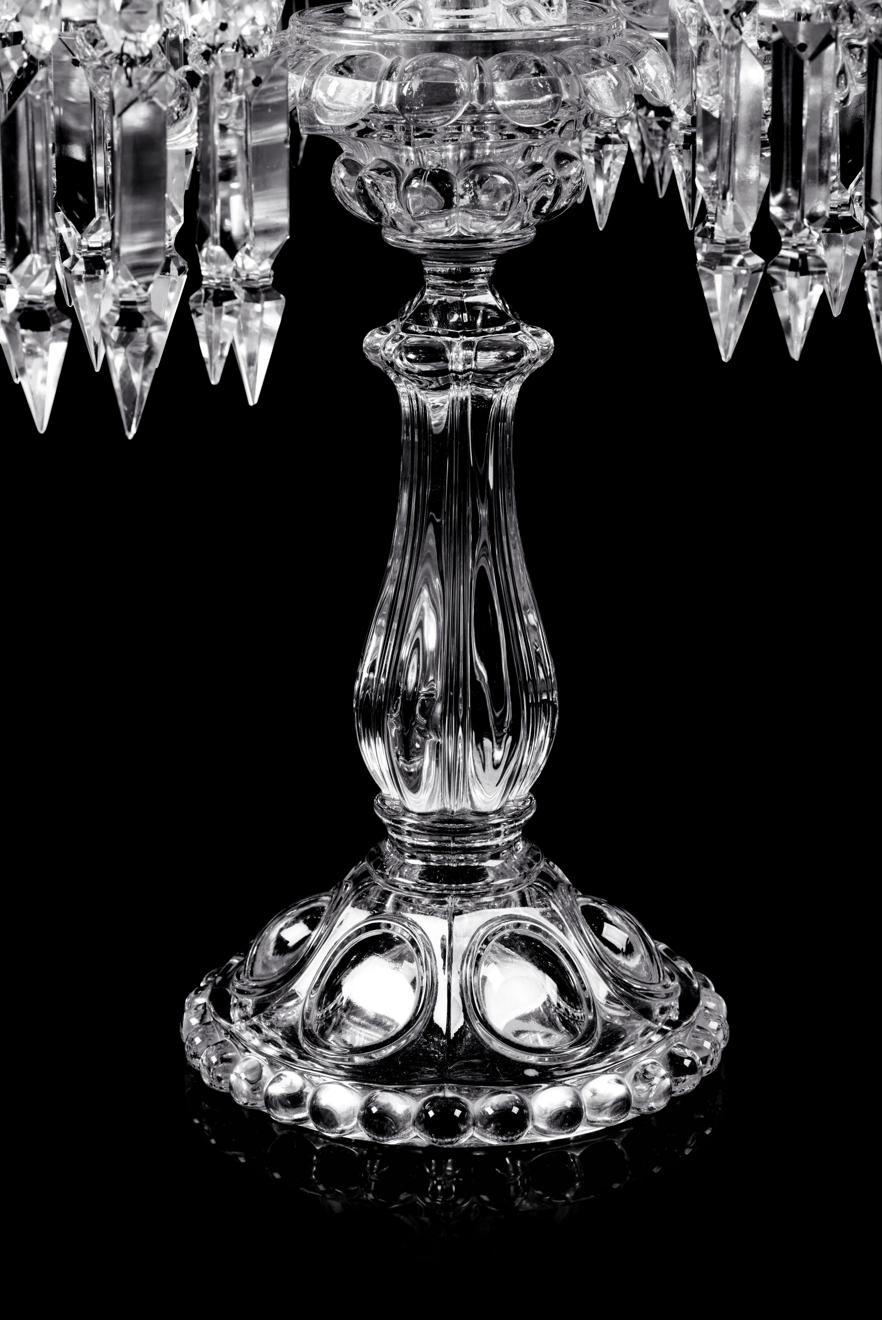 A Set of Three Baccarat Molded Glass Five-Light Candelabra