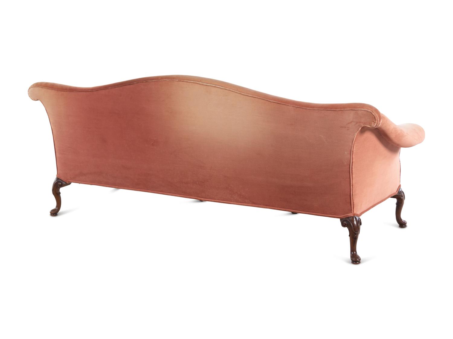 A George III Style Carved Mahogany Camel Back Sofa