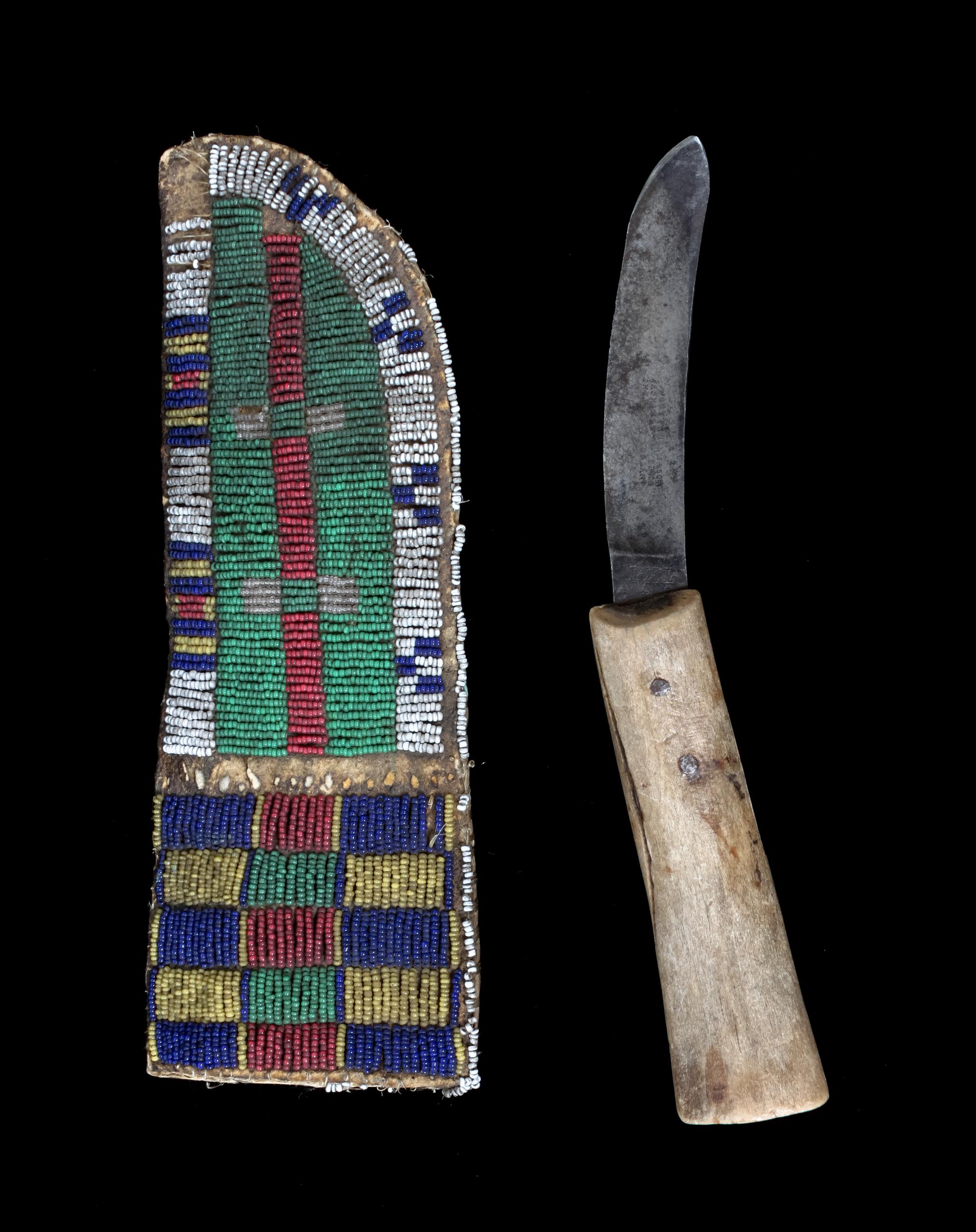 A Sioux Beaded Knife Sheath Height 12 x width 4 1/2 inches.