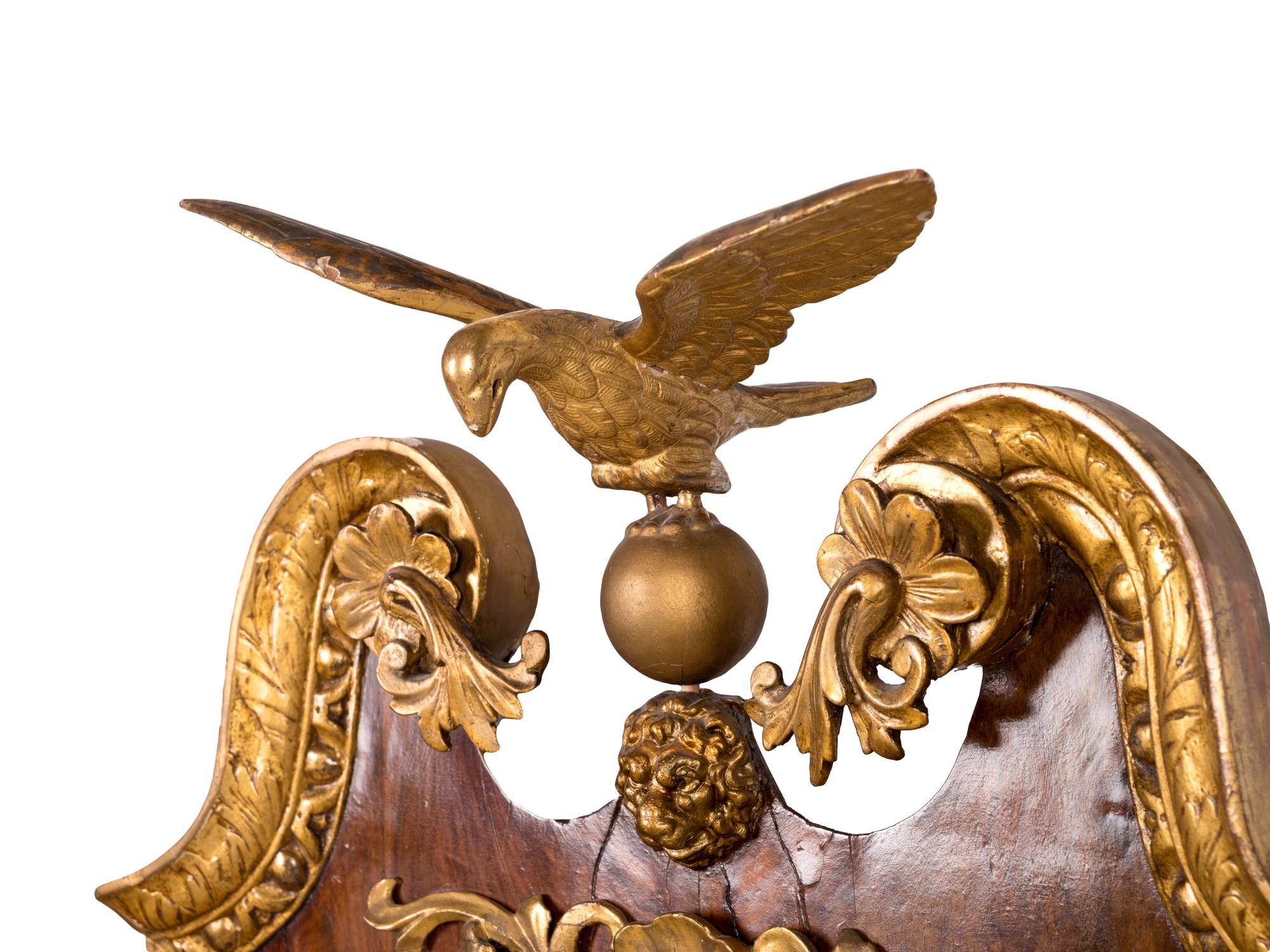 A George II Parcel Gilt Burl Walnut Girandole Mirror