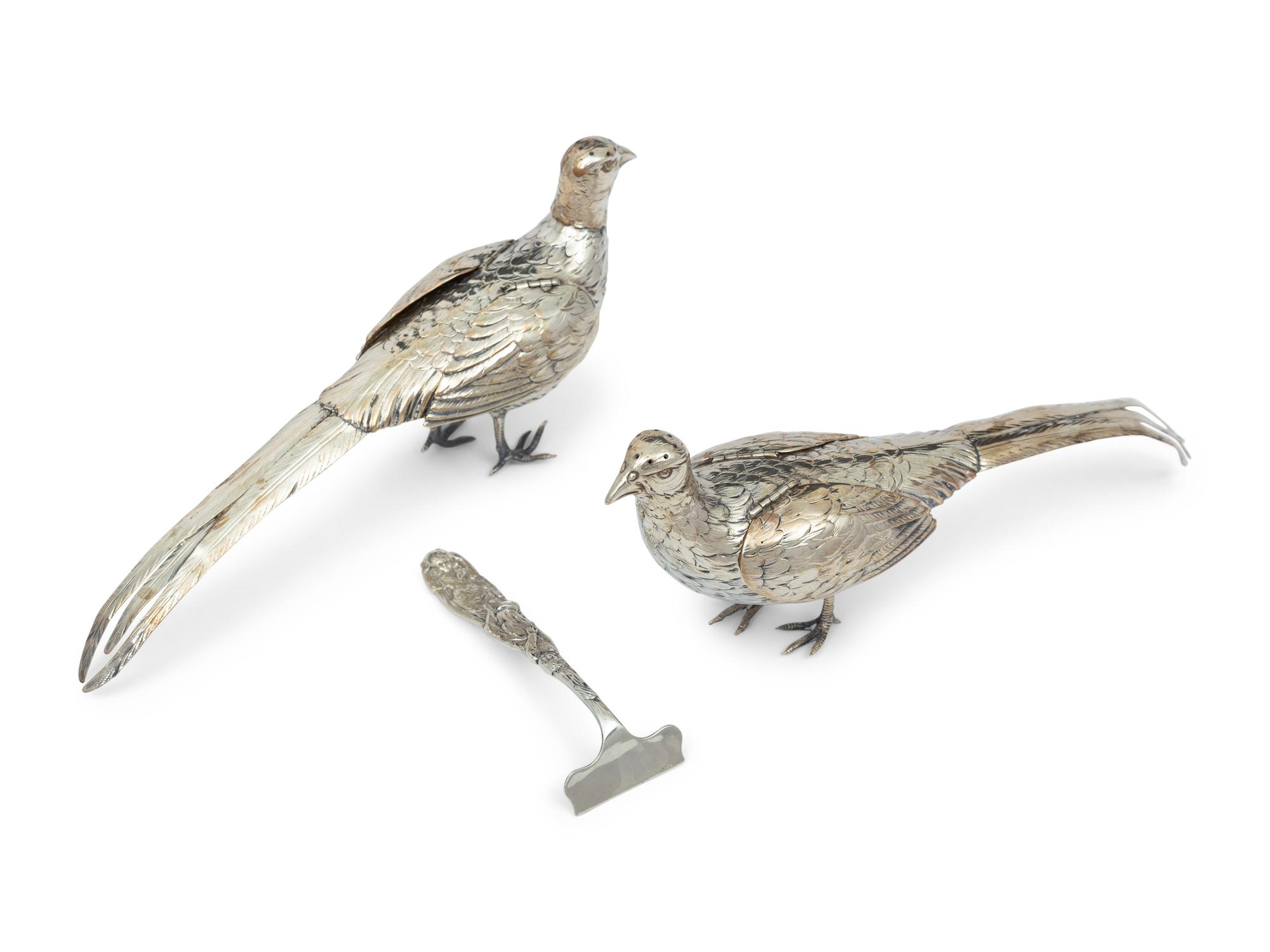 A Pair of German Silver Pheasant Form Casters