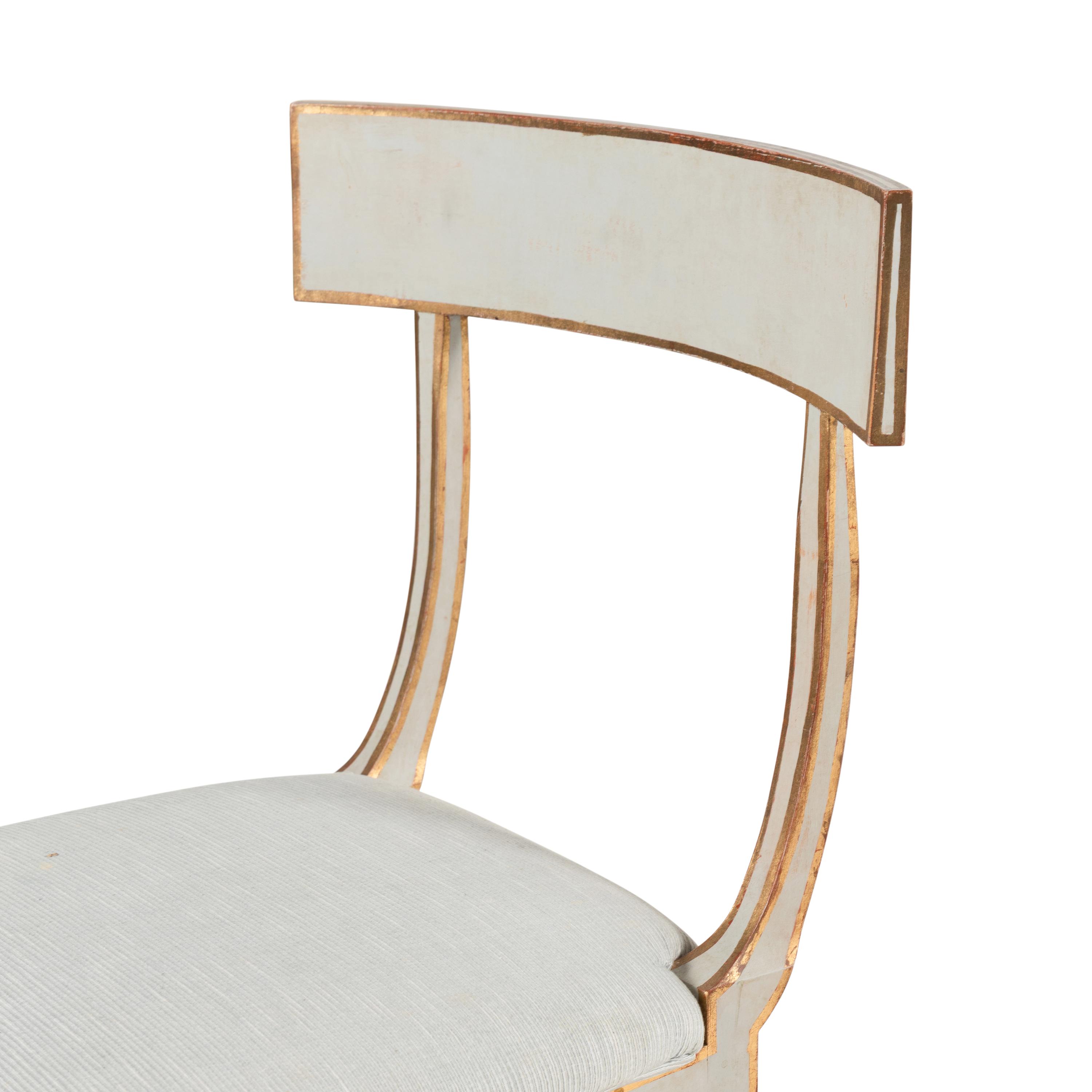 A Group of Six Light Blue-Painted and Parcel-Gilt Klismos Dining Chairs