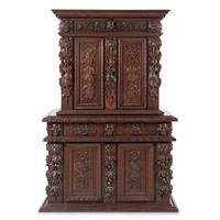 An Italian Renaissance Revival Carved Oak Cabinet