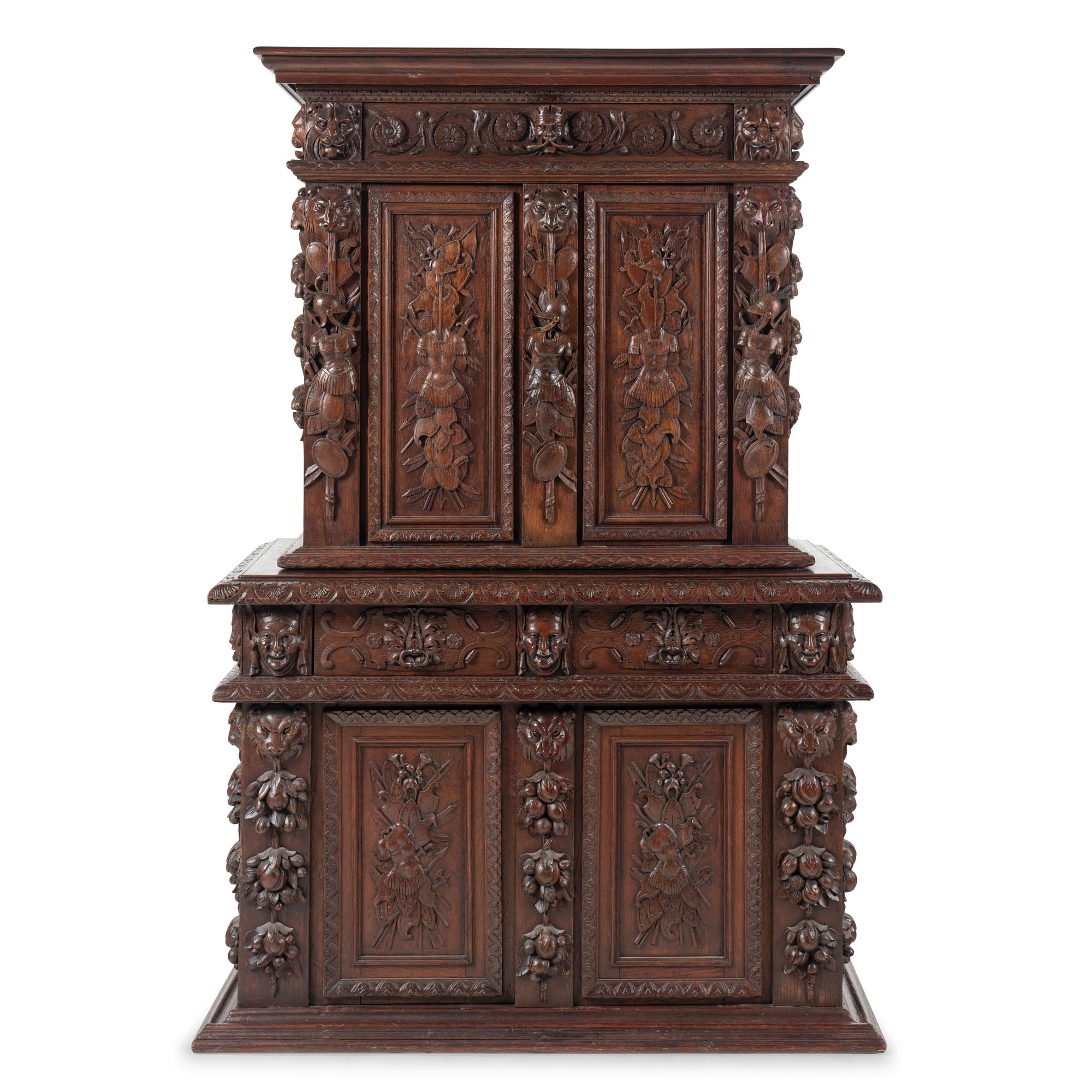 An Italian Renaissance Revival Carved Oak Cabinet