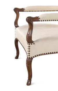 A Set of Four Régence Style Carved Walnut Library Chairs