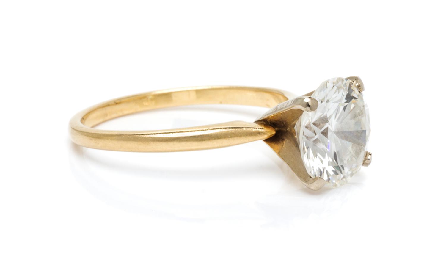 A Yellow Gold and Diamond Solitaire Ring, 1.50 dwts.