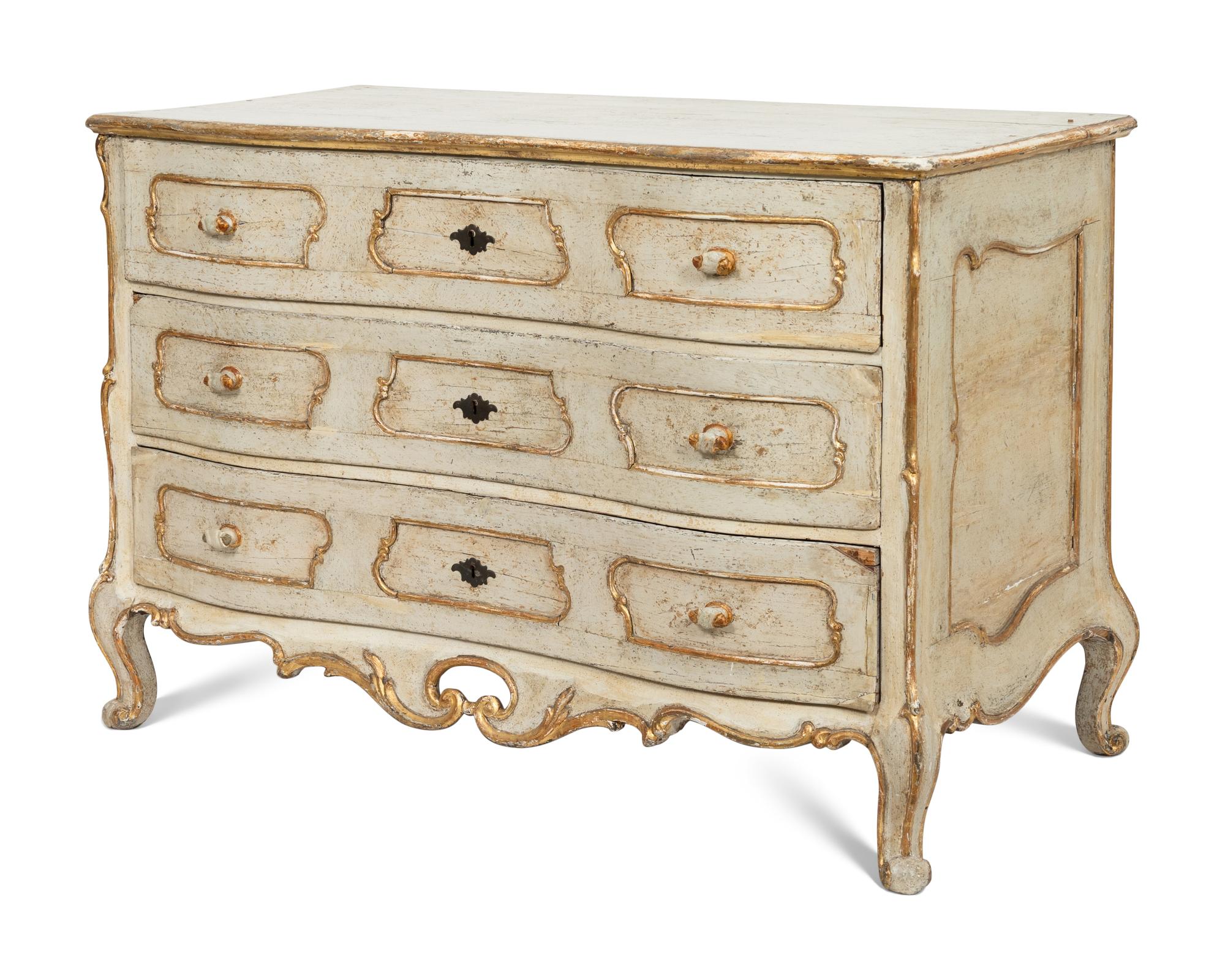 An Italian Rococo Cream-Painted and Parcel Gilt Commode
