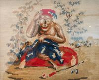A Framed Needlepoint of a Monkey Height 9 x width 11 1/4 inches.