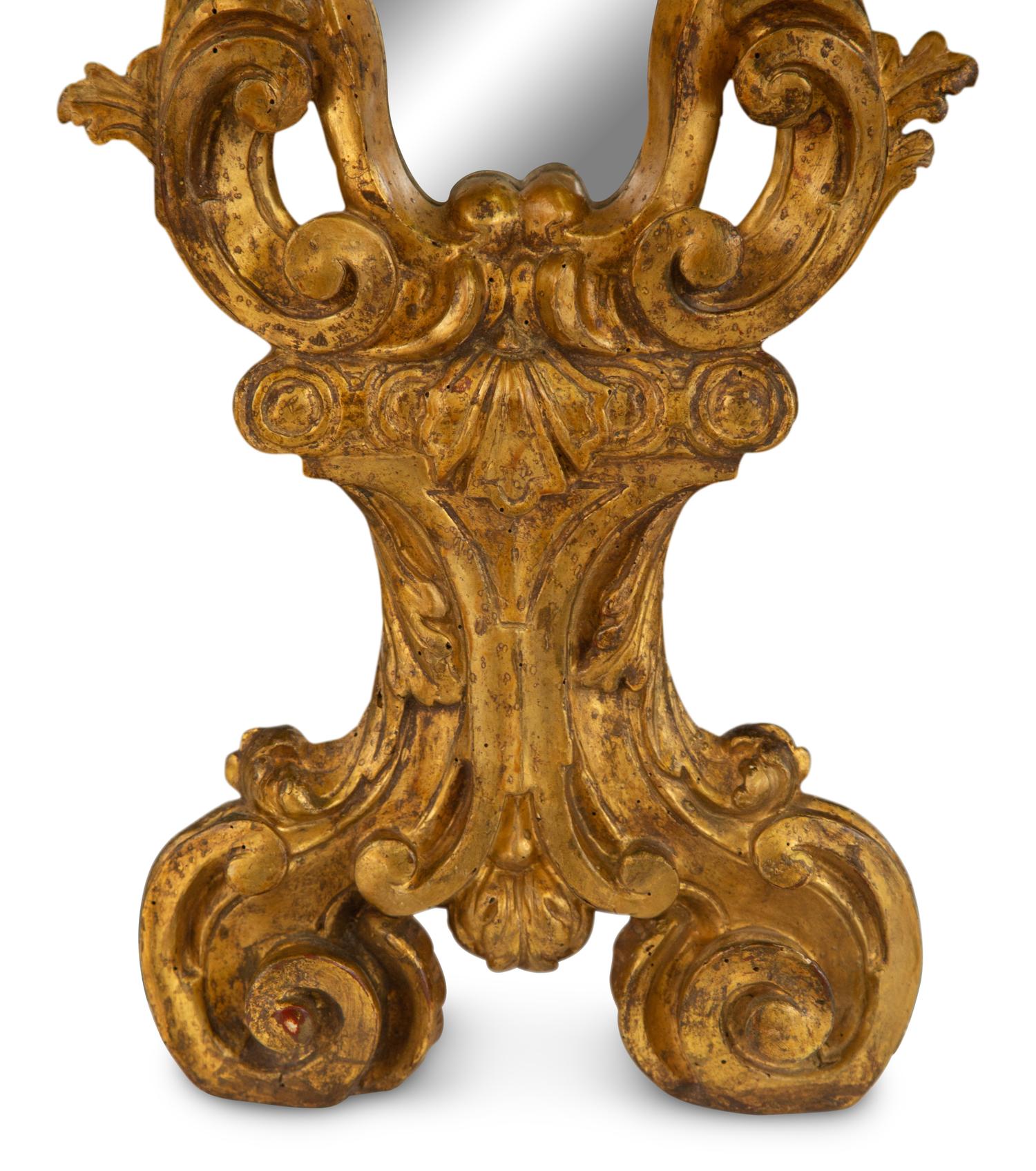 A Venetian Rococo Style Giltwood Mirror