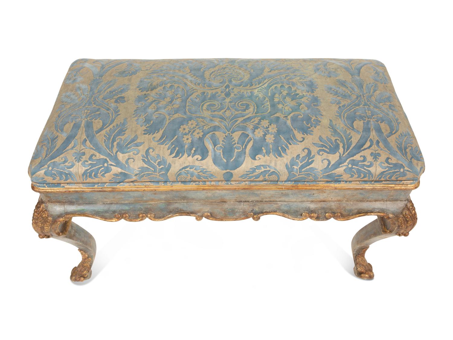 An Italian Painted and Parcel Gilt Bench with Fortuny Upholstery
