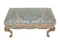 An Italian Painted and Parcel Gilt Bench with Fortuny Upholstery
