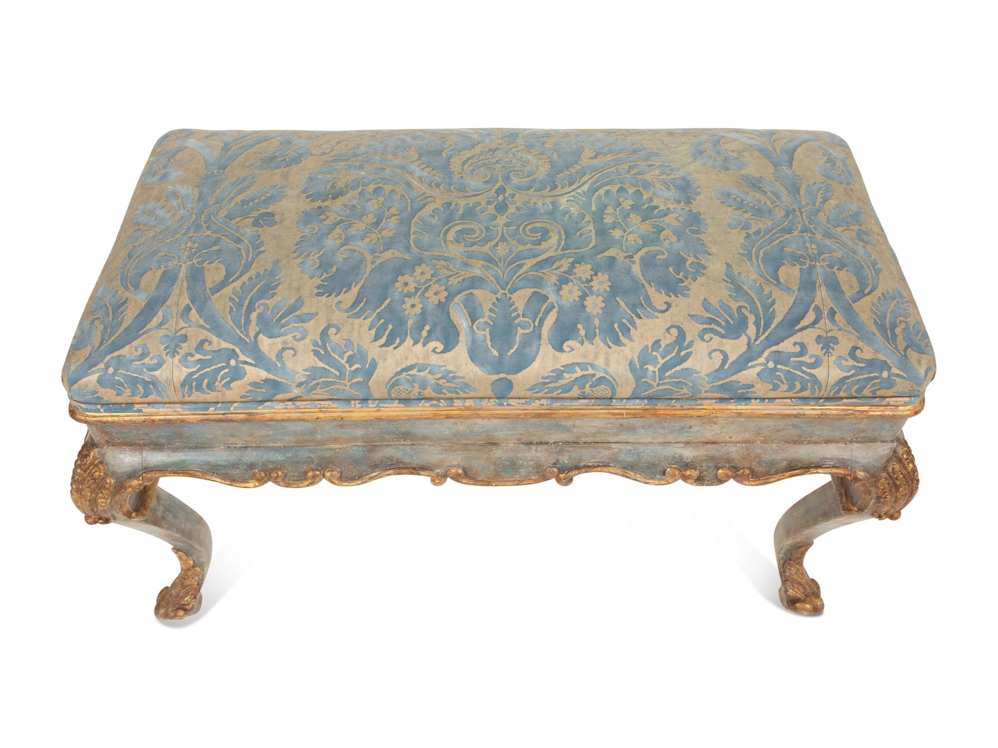 An Italian Painted and Parcel Gilt Bench with Fortuny Upholstery