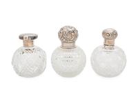 Three English Silver Mounted Cut Glass Bottles