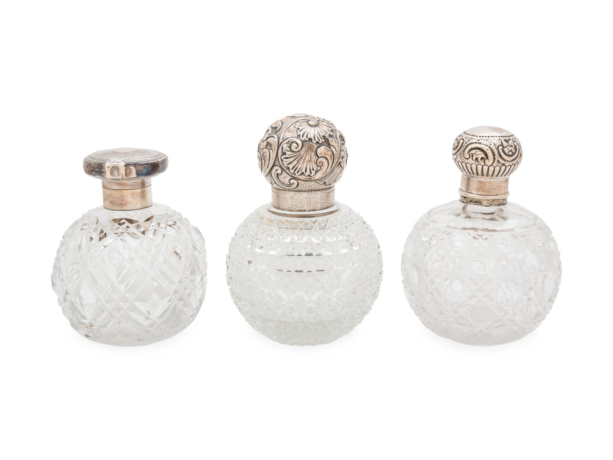 Three English Silver Mounted Cut Glass Bottles