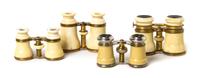 Four Pairs of French Ivory Veneered Opera Glasses, Width of widest 4 1/2 inches.