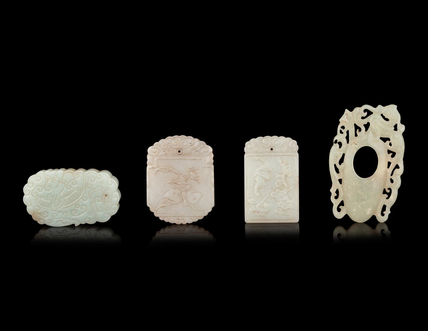 Seven Chinese Carved Celadon Jade Pendants
