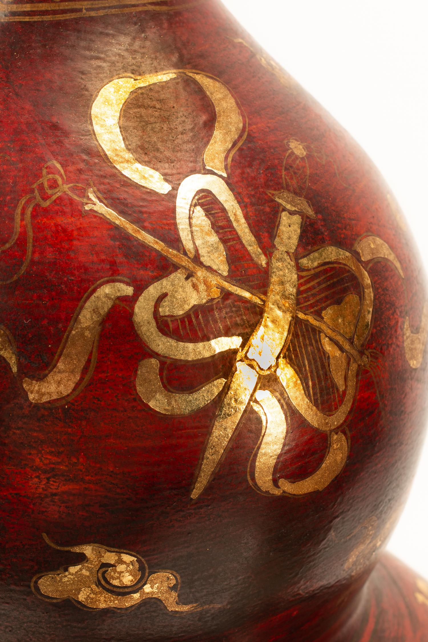 A Pair of Chinese Export Gold and Red Lacquer Vases with Gilt Bronze Stands