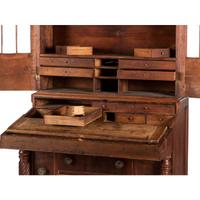 A Classical Figured Maple and Mahogany Desk-and-Bookcase