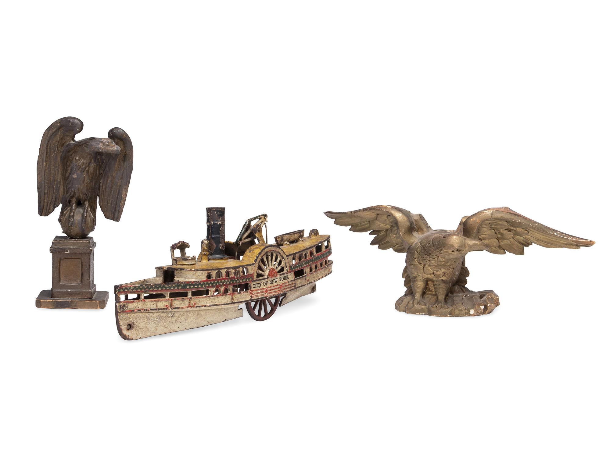 Two Carved and Painted Wood Eagle Finials, and a Cast Iron Paddleboat Boat Toy