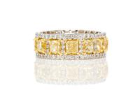 A Platinum, Yellow Gold, Fancy Yellow Diamond and Diamond Eternity Band Ring, 7.90 dwts.