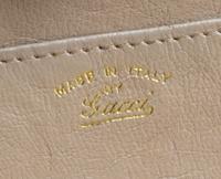 A Gucci Light Brown Reptile Skin Clutch, 10.5" x 5" x 1".