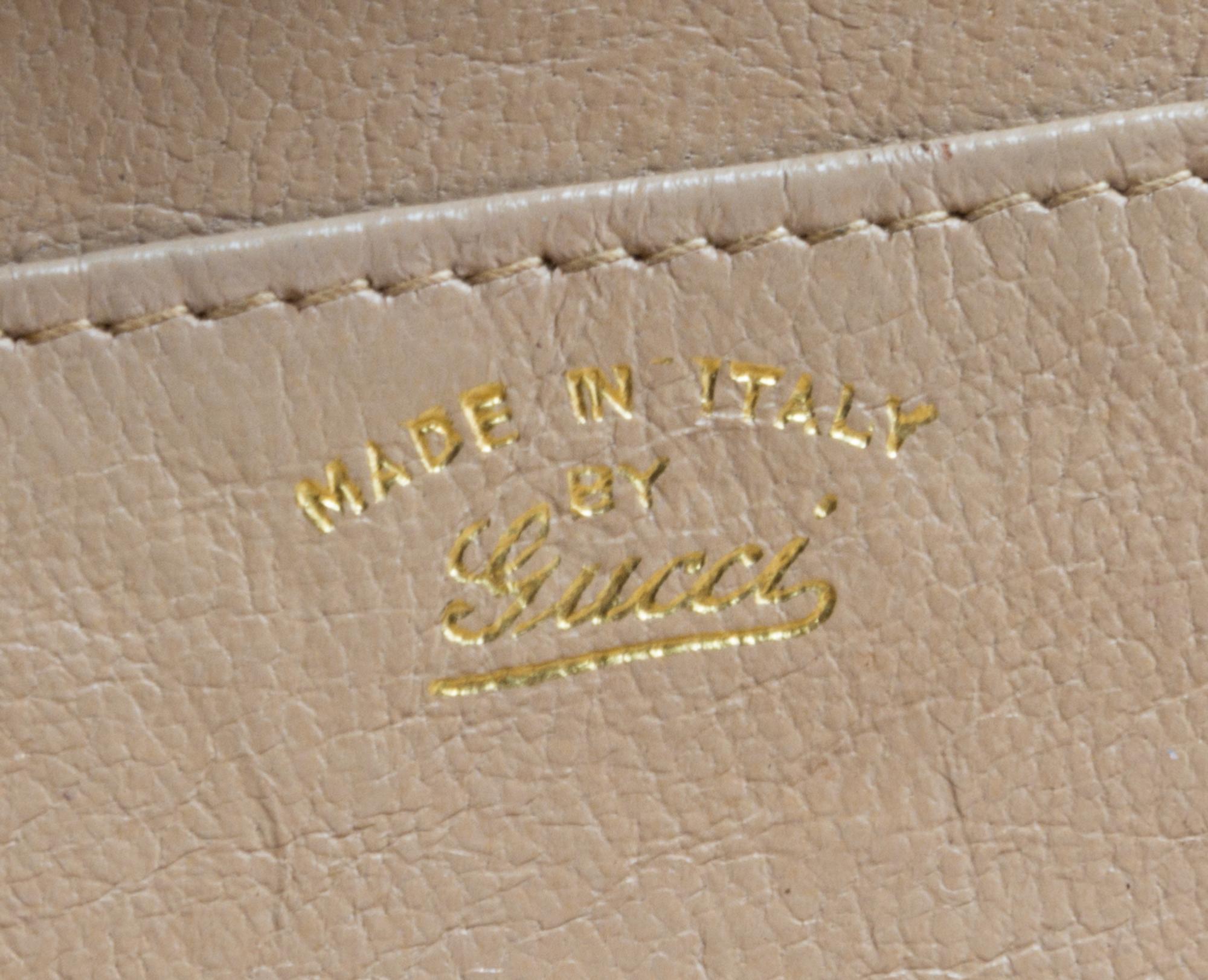 A Gucci Light Brown Reptile Skin Clutch, 10.5" x 5" x 1".