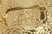 A Pair of Gianni Versace Medusa and Rhinestone Fringe Earclips, Medallions: 1.25" and 1.5" diameters; Drop: 4.75".
