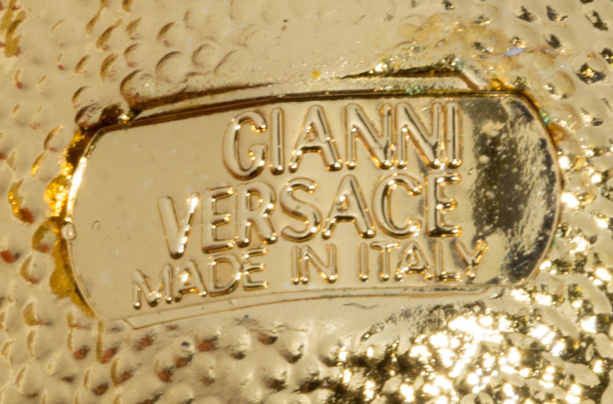 A Pair of Gianni Versace Medusa and Rhinestone Fringe Earclips, Medallions: 1.25" and 1.5" diameters; Drop: 4.75".