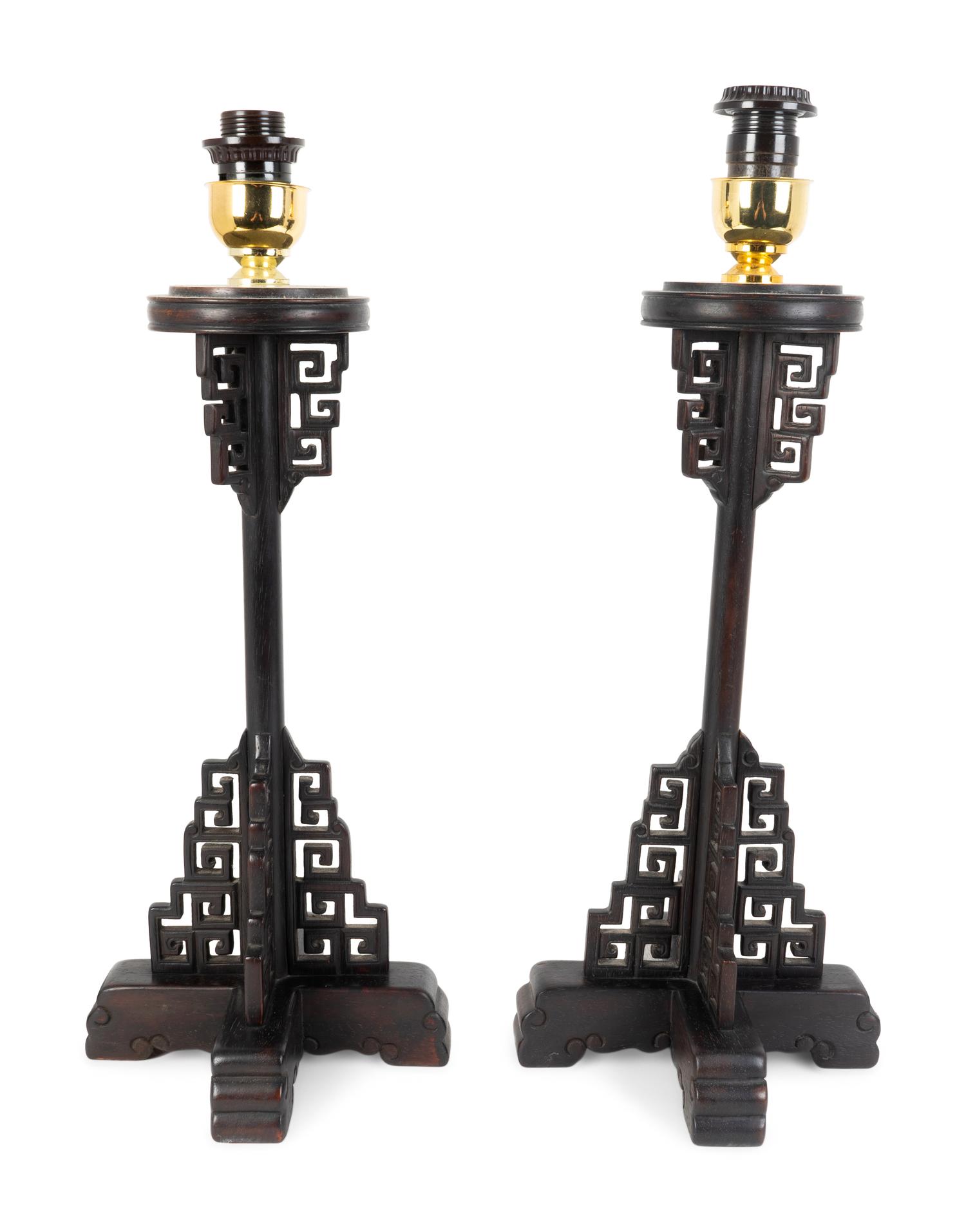 A Pair of Chinese Style Pierced and Ebonized Wood Table Lamps — MID-20TH CENTURY
