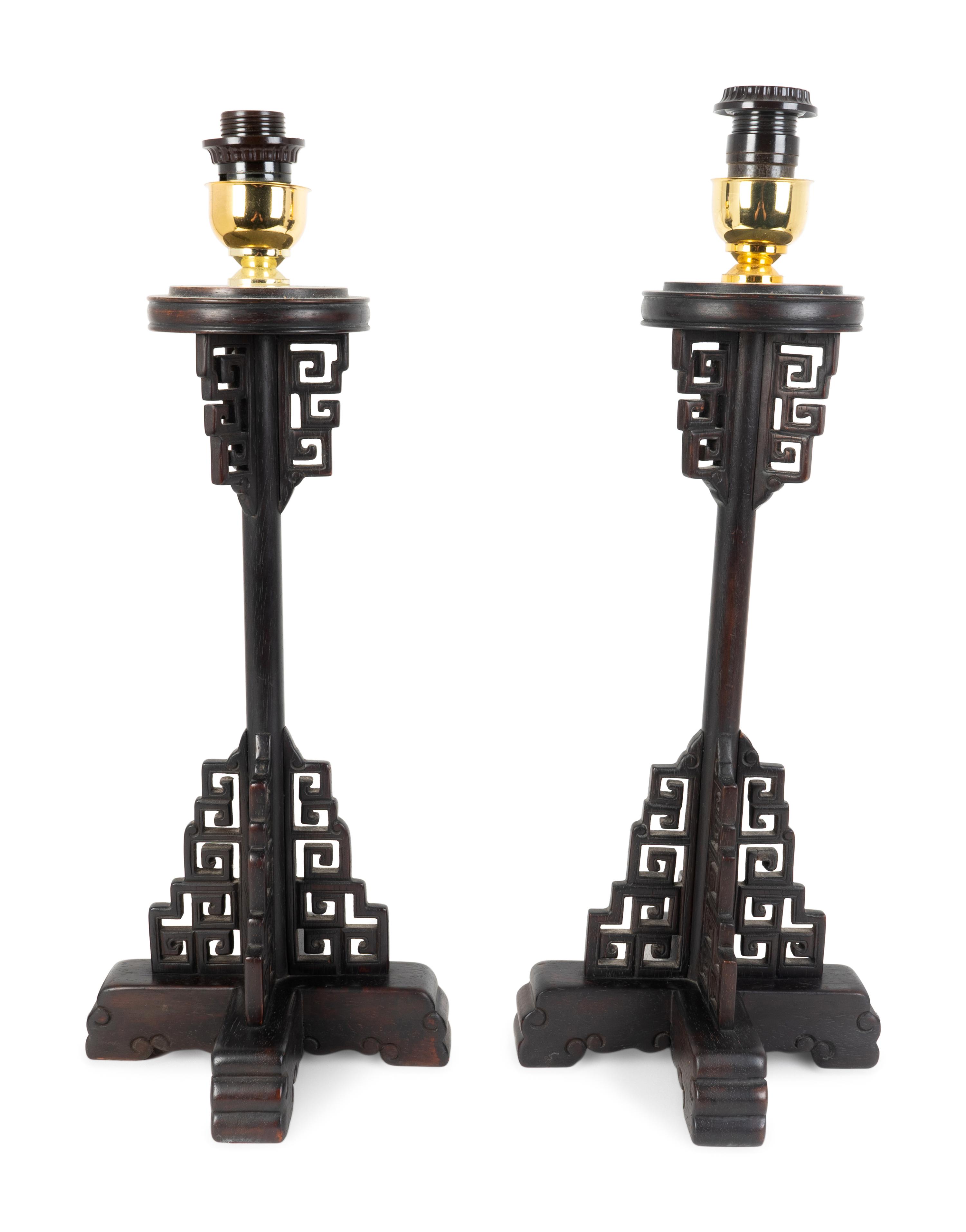 A Pair of Chinese Style Pierced and Ebonized Wood Table Lamps — MID-20TH CENTURY