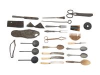 [CAMP LIFE]. A group of branding irons, utensils, and other camp tools.