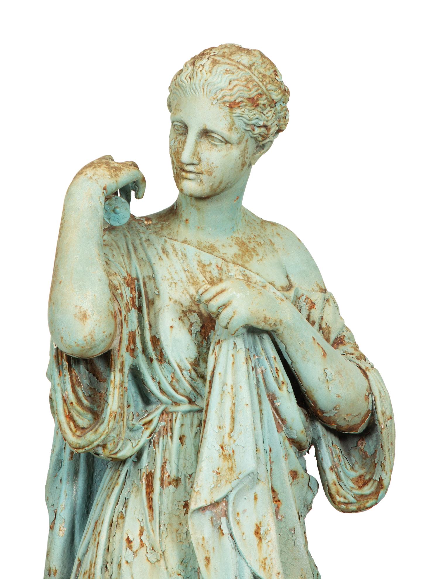 A Painted Cast Iron Diana of Gabii on a Carved Stone Base
