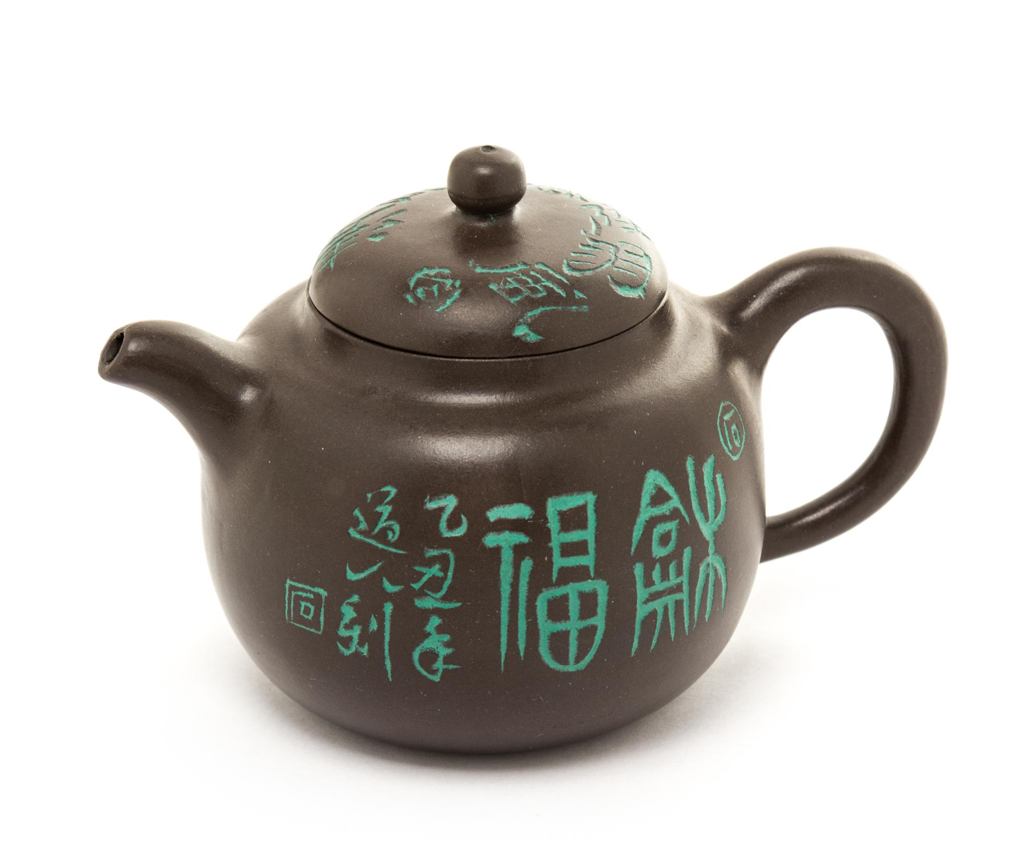 A Yixing Pottery Teapot Height 3 1/4 inches.