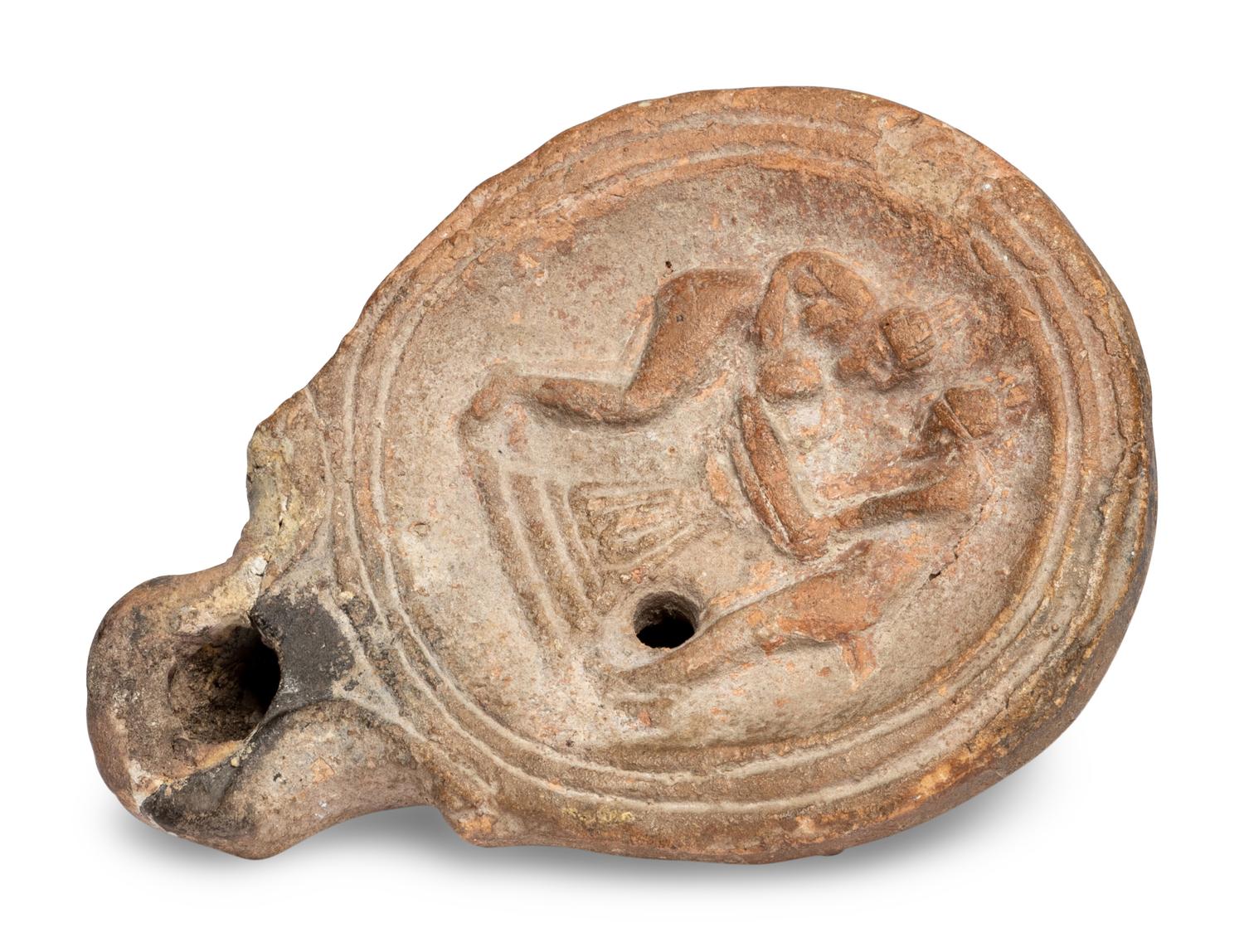 A Roman Terracotta Oil Lamp with Two Women