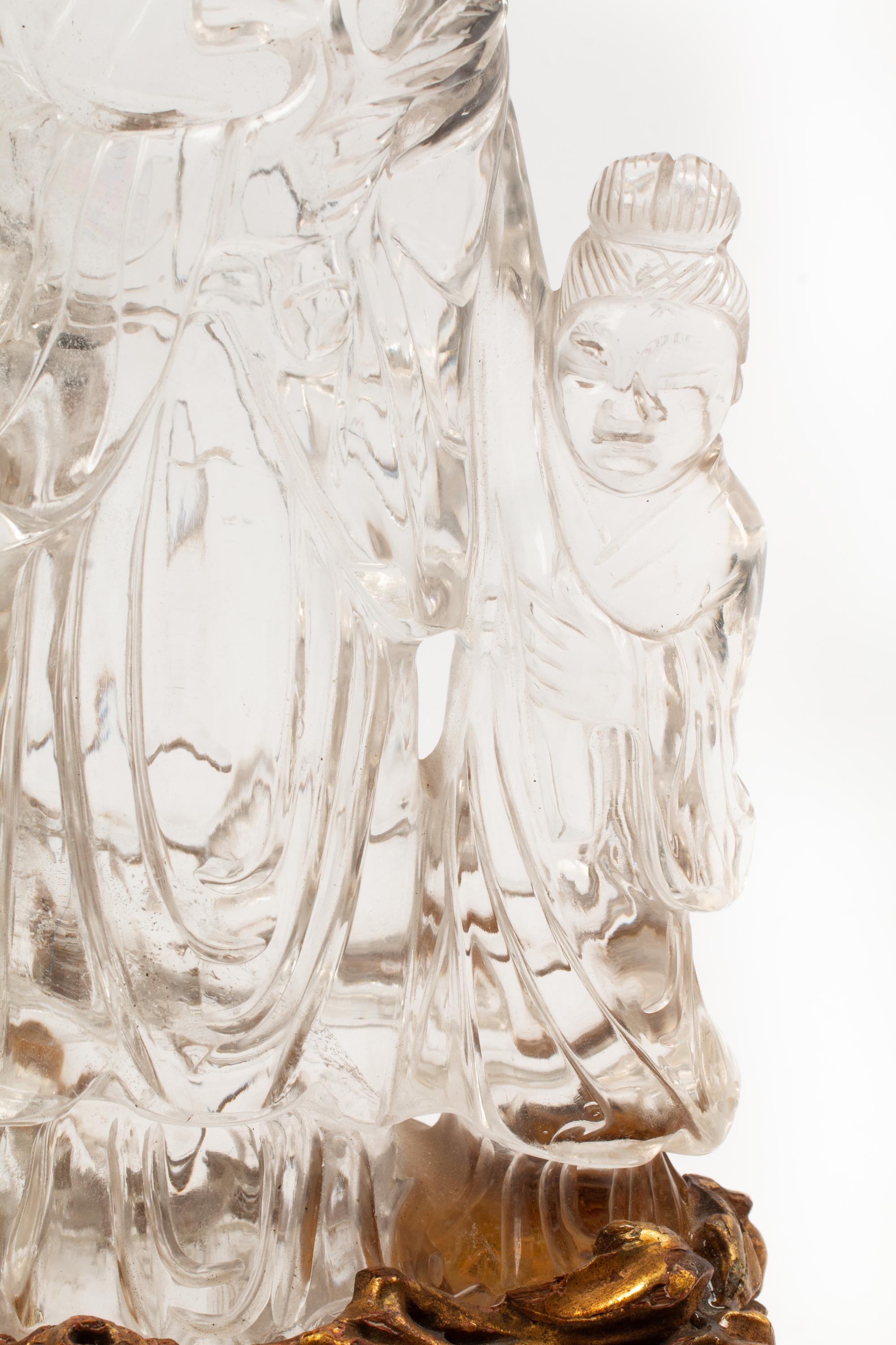 A Carved Rock Crystal Figure of Guanyin on a Giltwood Base