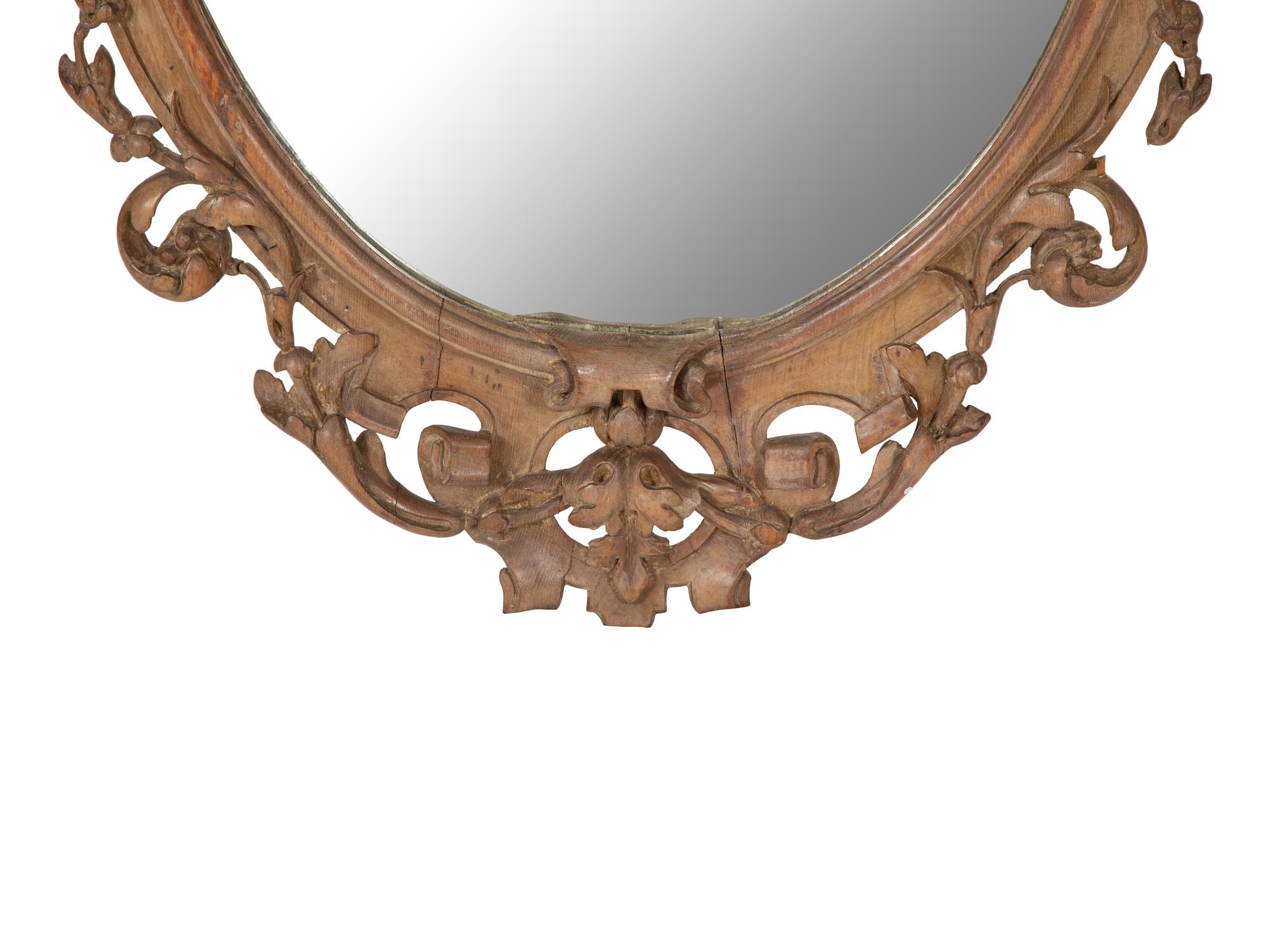 An Italian Baroque Style Carved Walnut Mirror