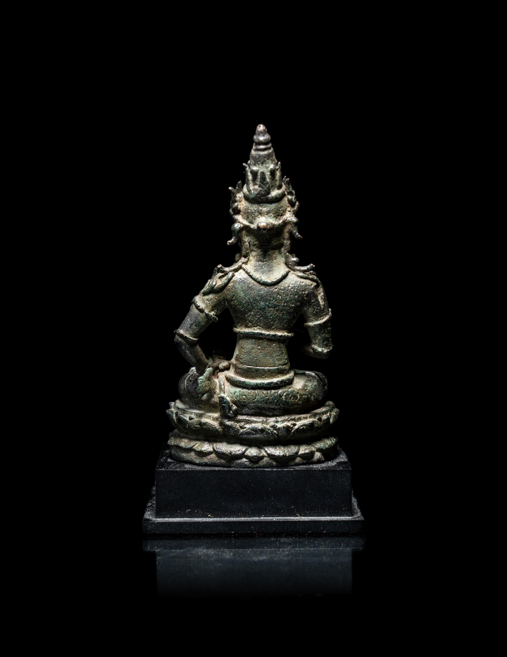 A Small Indonesian Bronze Figure of a Female Retinue