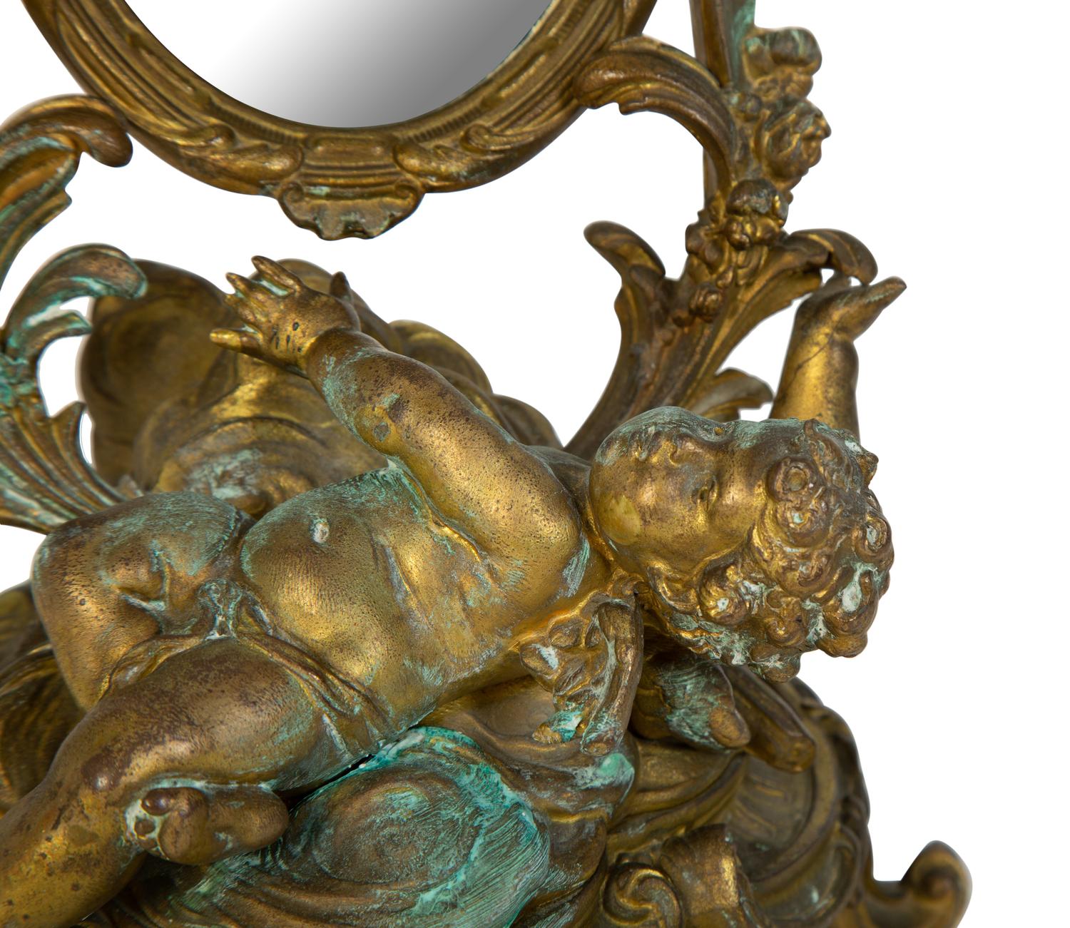A Continental Rococo Style Gilt Metal Table Mirror
