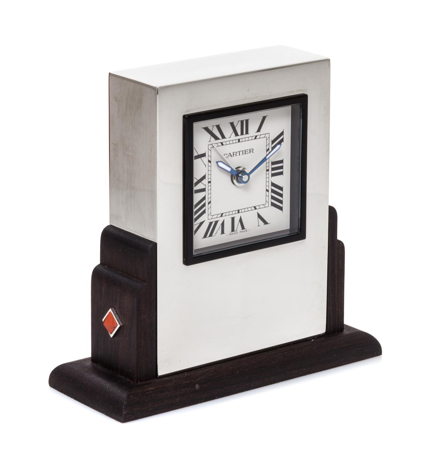 A Cartier Art Deco Style Travel Alarm Clock Height 3 1/2 x width 3 3/8 x depth 1 3/8 inches. — 20TH CENTURY