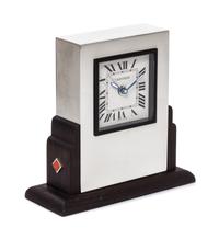 A Cartier Art Deco Style Travel Alarm Clock Height 3 1/2 x width 3 3/8 x depth 1 3/8 inches. — 20TH CENTURY