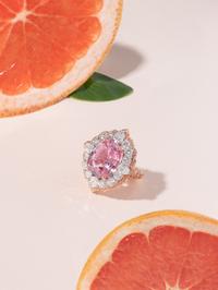 PADPARADSCHA SAPPHIRE, PINK DIAMOND AND DIAMOND RING
