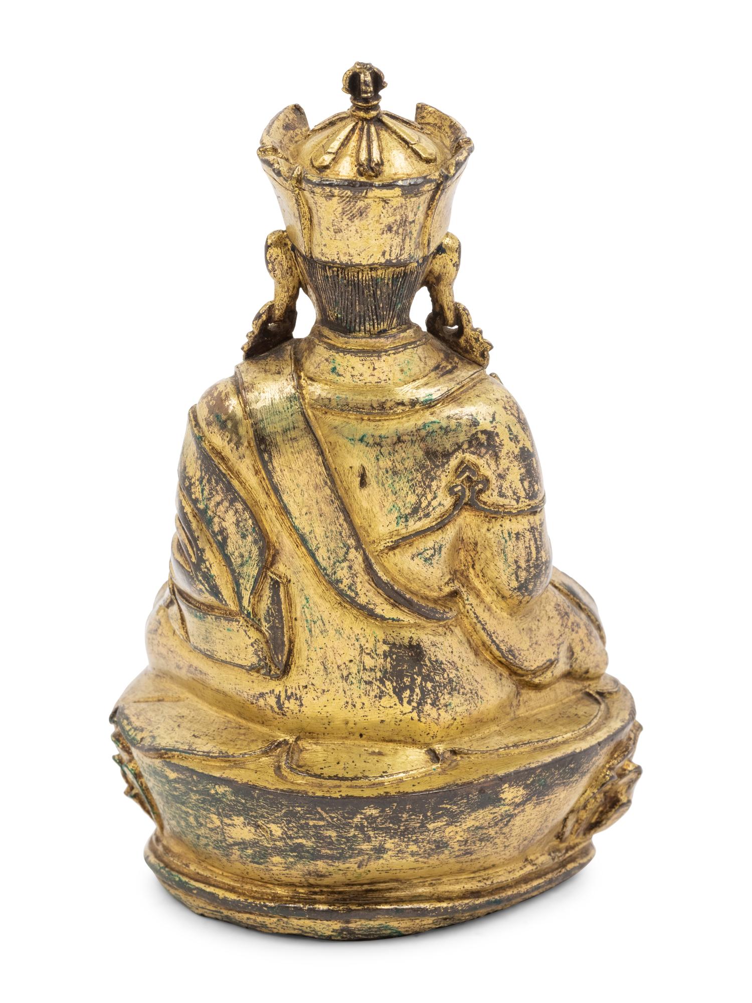 A Tibetan Gilt Bronze Figure of a Seated Karmapa