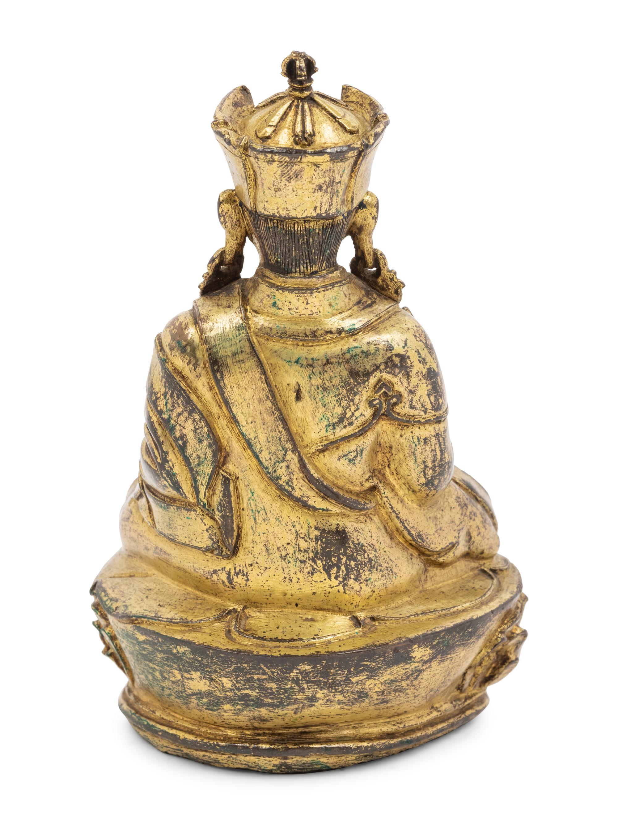 A Tibetan Gilt Bronze Figure of a Seated Karmapa